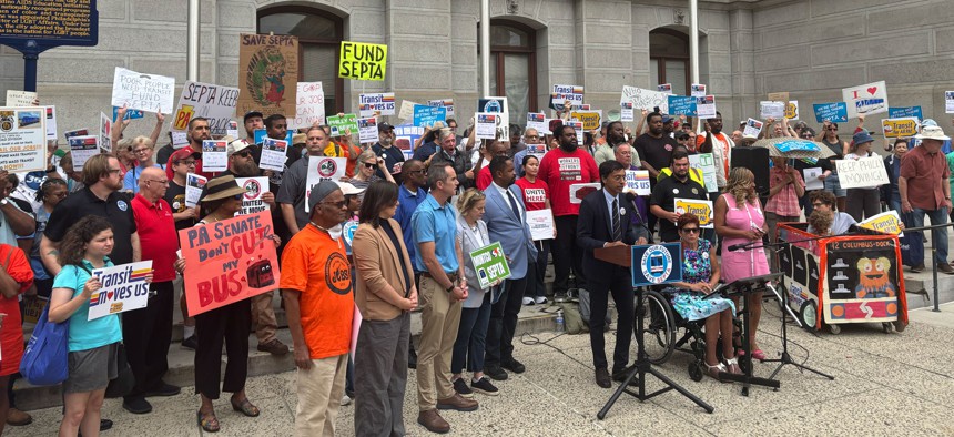 Lawmakers and transit advocates speak at a press conference outside Philadelphia City Hall on Wednesday, August 6, 2025.