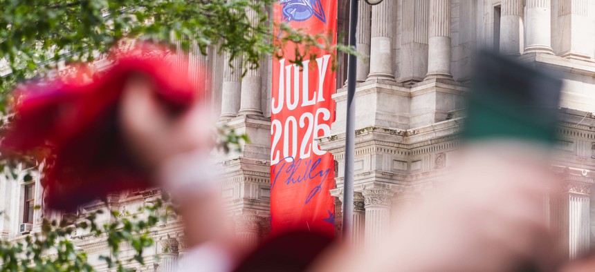Phhiladelphians celebrate the unveiling of the 2026 MLB All-Star Game logo outside City Hall on July 18, 2025.