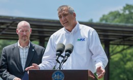 PUC Chair Stephen DeFrank speaks at a 2025 press conference about solar energy.