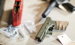 Firearms displayed at a 2019 press conference focused on unserialized “ghost guns.”