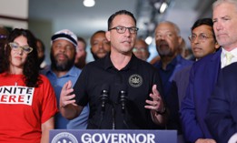 Gov. Josh Shapiro speaks at an August 2025 press conference about mass transit funding.