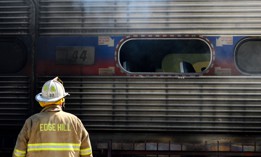Firefighters battle a fire on a commuter train, at SEPTA’s Glenside, PA station on August 29, 2018