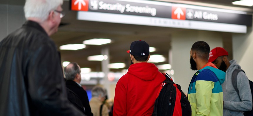 Travelers wait in long lines after Philadelphia Airport TSA and airport workers held a protest rally outside the Philadelphia International Airport on January 25, 2019.