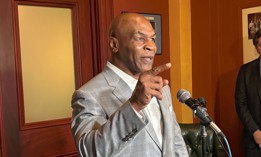 Mike Tyson speaks with reporters in the Pennsylvania Capitol.