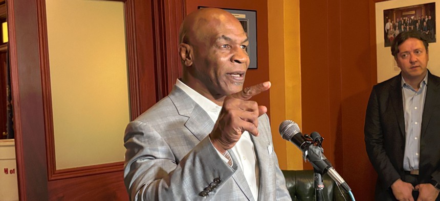 Mike Tyson speaks with reporters in the Pennsylvania Capitol.