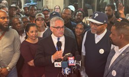 Philadelphia District Attorney Larry Krasner, holding microphone, after his victory in the May primary.