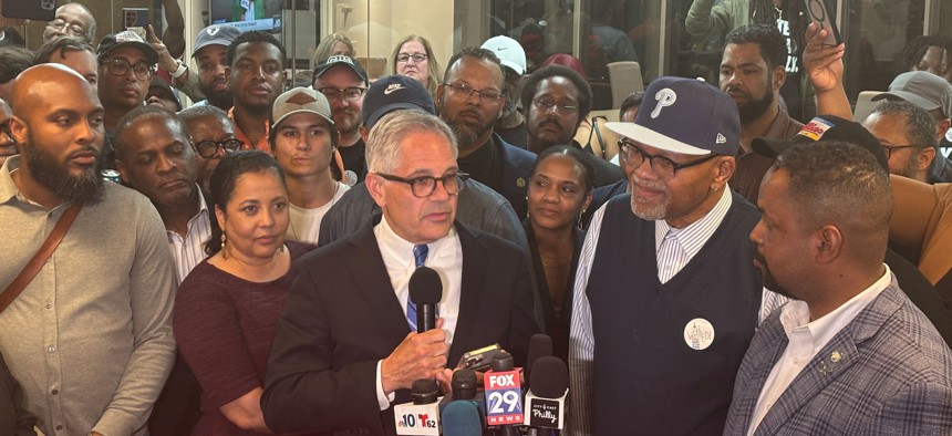 Philadelphia District Attorney Larry Krasner, holding microphone, after his victory in the May primary.