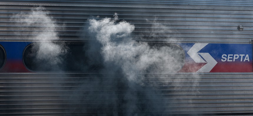 Firefighters battle a fire on a commuter train at SEPTA's Glenside station in Suburban Philadelphia on August 29, 2018.