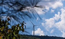 A wind turbine is seen above Sugar Hollow Road in Wyoming County.