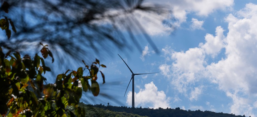 A wind turbine is seen above Sugar Hollow Road in Wyoming County.