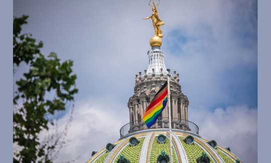 A Pride flag flies at the Pennsylvania Capitol. 