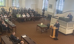 U.S. Rep. Brendan Boyle speaks at the lectern during a ceremonial gathering of members of Congress at Congress Hall in Philadelphia. Seated behind him is U.S. Rep Glenn Thompson, the chair of the session.