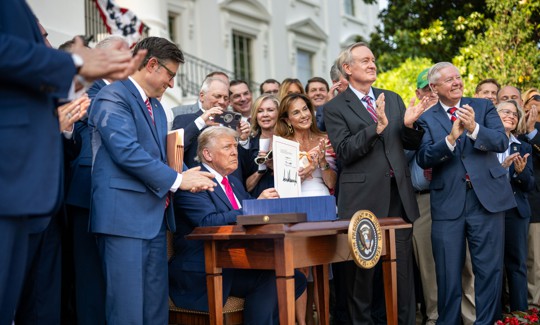President Donald Trump signs the One Big Beautiful Bill Act into law on July 4, 2025.