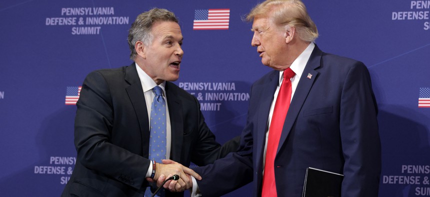 U.S. Sen. Dave McCormick speaks with President Donald Trump at the 2026 Pennsylvania Defense and Innovation Summit.