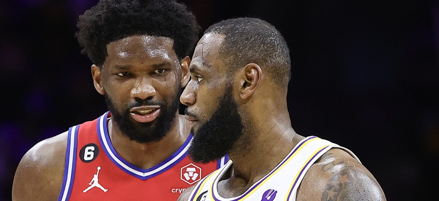 LeBron James, shown here competing against his now-teammate on the Philadelphia 76ers, Joel Embiid.