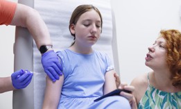 A young patient gets vaccinated at a family medicine clinic in the Poconos.