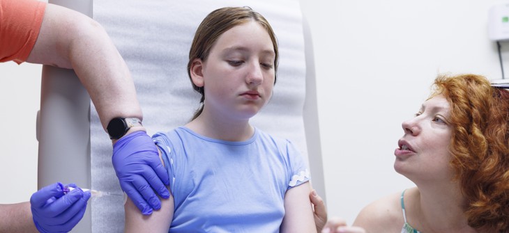 A young patient gets vaccinated at a family medicine clinic in the Poconos.