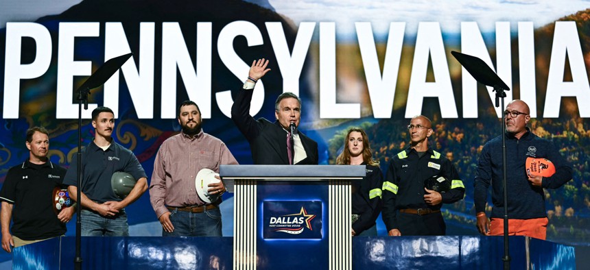 U.S. Sen. Dave McCormick is joined onstage by members of Pennsylvania’s steel and manufacturing industries at the Republican Party’s midterm convention.