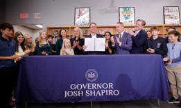 Gov. Josh Shapiro signs a bell-to-bell school cell phone ban into law at the Central Bucks School District.